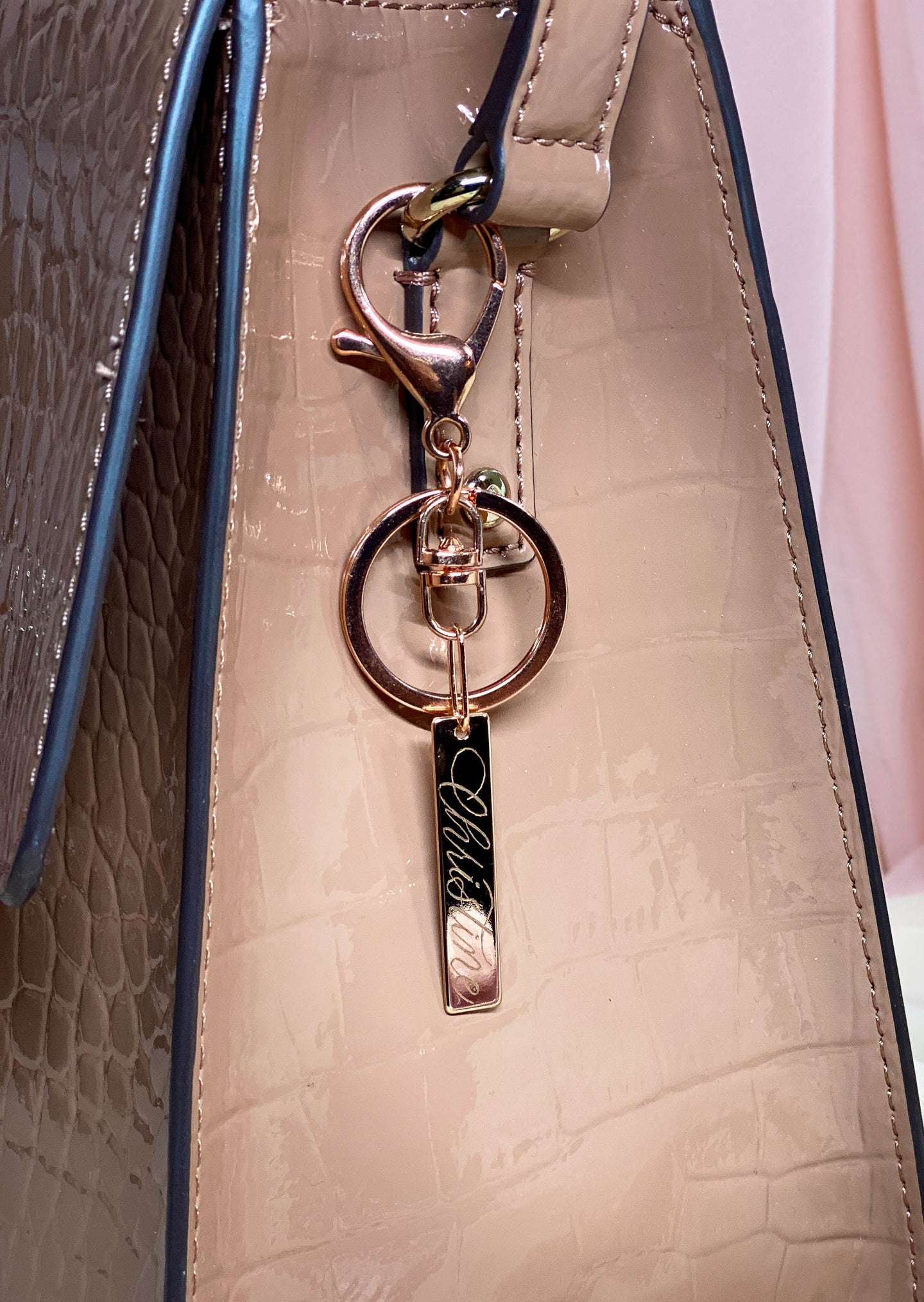 rose gold personalized bar charm on purse